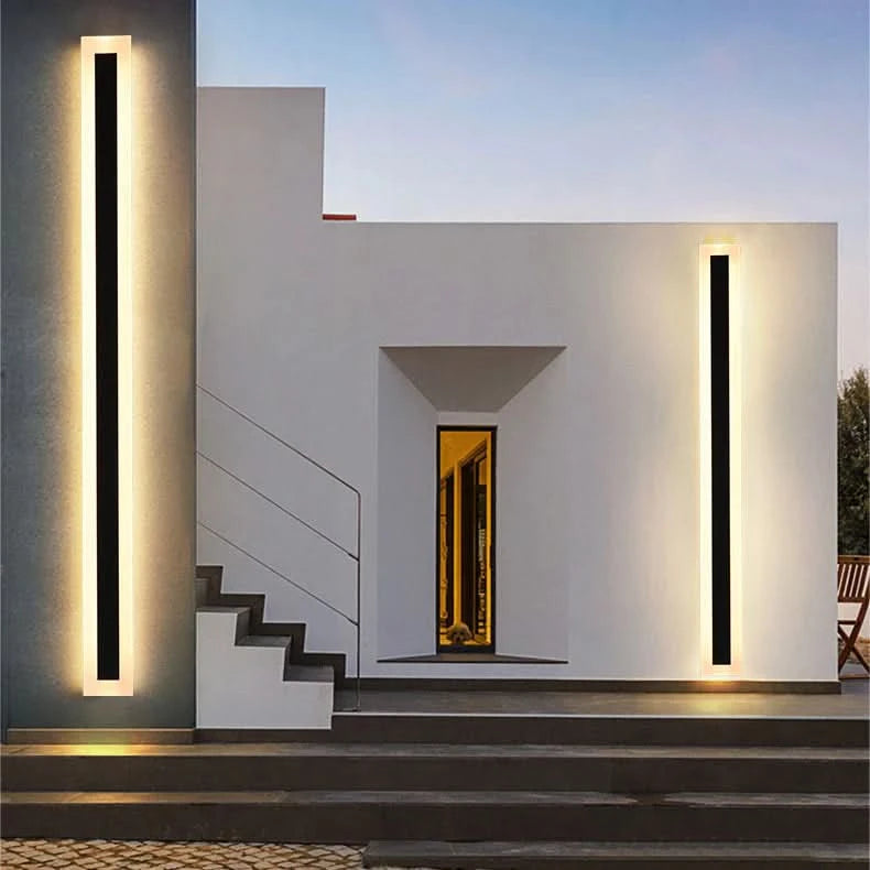 Halo Outdoor wall lamp glowing at night