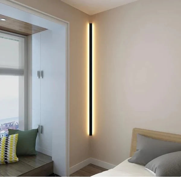 Aeris Linear wall lamp glowing on wall